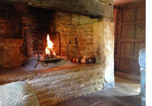 The cosy fireplace at the Secret Cottage in the Cotswolds