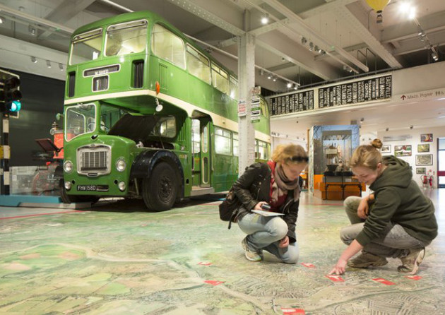 Visitors in the M-Shed Bristol museum with vintage bus. Photo: VisitEngland/Iain Lewis