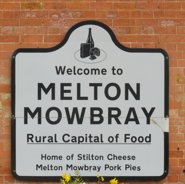 Station sign at Melton Mowbray makes it clear what the town is famous for! © Norman Miller