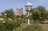 Dovecote in the Orchard at Sissinghurst Castle, Kent, with the Elizabethan Tower seen in the background.