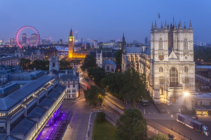 Westminster Abbey and the River Thames. The London Eye in the background. Credit: Visit Britain