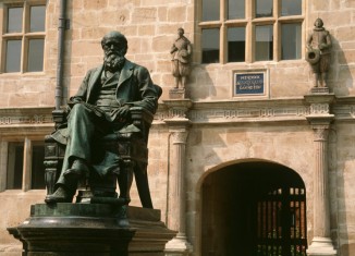 A statue of Charles Darwin stands outside the library