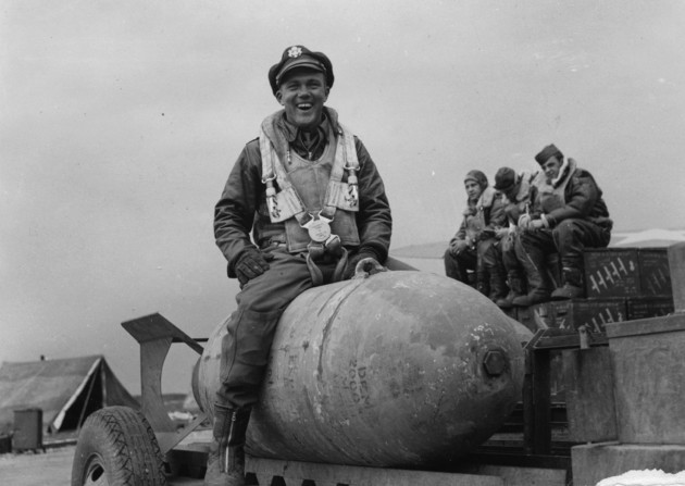 Lieutenant Stanley Stedt, a bombardier of the 306th Bomb Group astride a bomb. Photo: Imperial War Museum