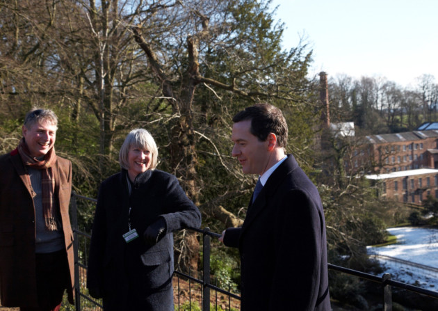 (Left to right) John Darlington, National Trust Director of Region North West, Sara Burdett, Quarry Bank Project Manager and MP for Tatton George Osborne with Quarry Bank Mill as a backdrop below. Photo copyright: National Trust Images