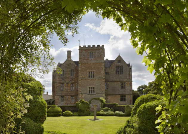 The interior of Chastleton House, Oxfordshire, became Wolf Hall itself. View through the Topiary Garden to the east front. Photo ©National Trust Images/Arnhel de Serra