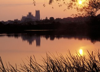 Ely Cathedral silhouetted at sunset. Credit: VisitBritain
